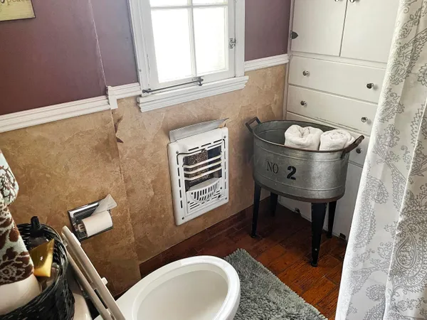 a bathroom with a sink a toilet and mirror