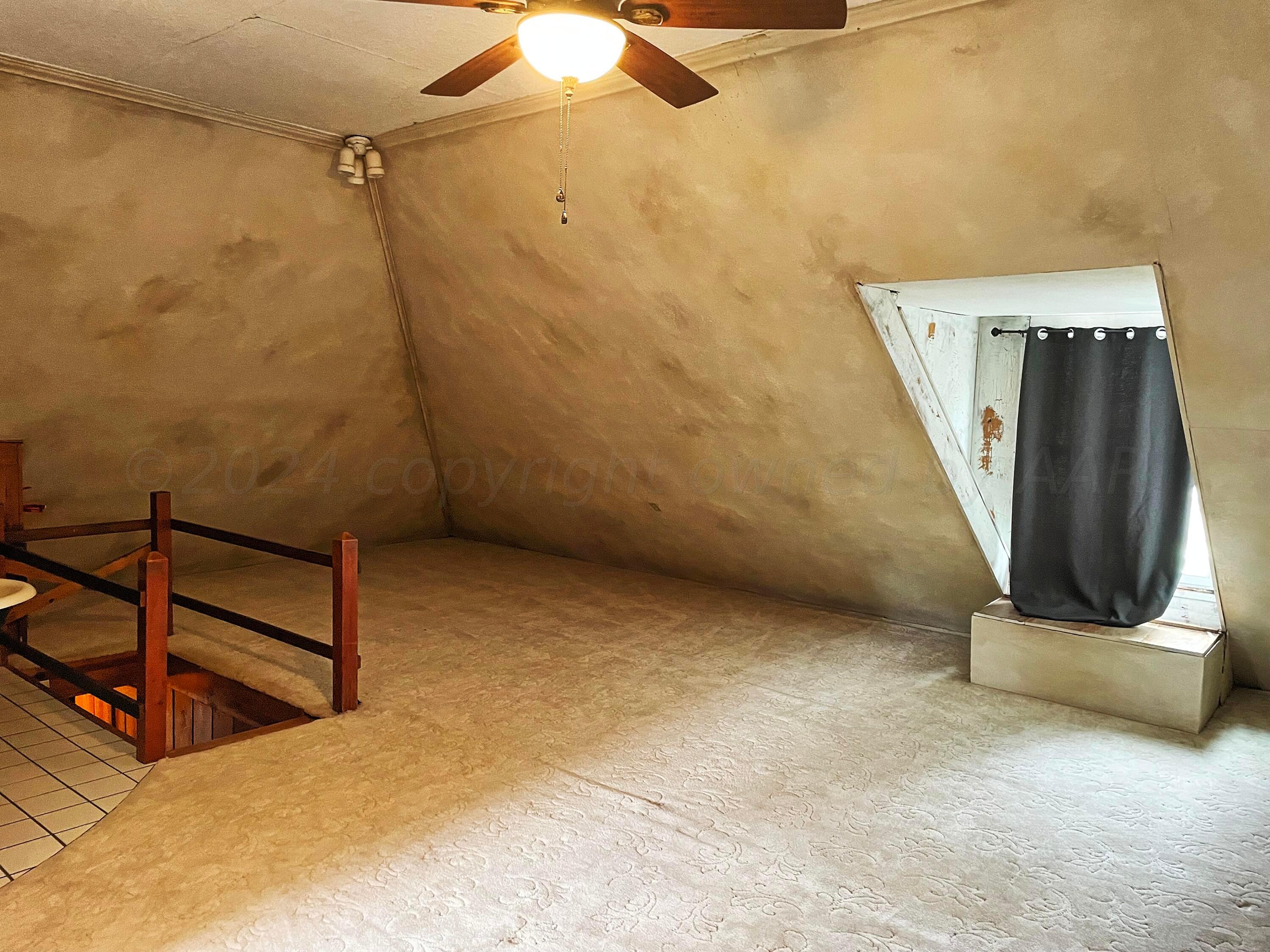 302 South Baylor Street Perryton, TX 79070 - Photo 16 of 21 a view of a room with wooden walls