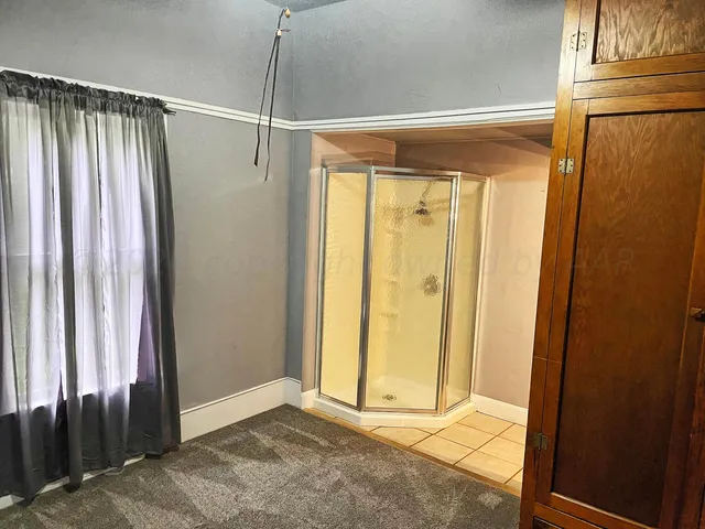 a view of a bathroom with a glass door