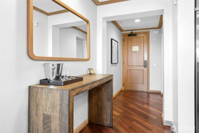 a bathroom with a granite countertop sink a mirror and vanity