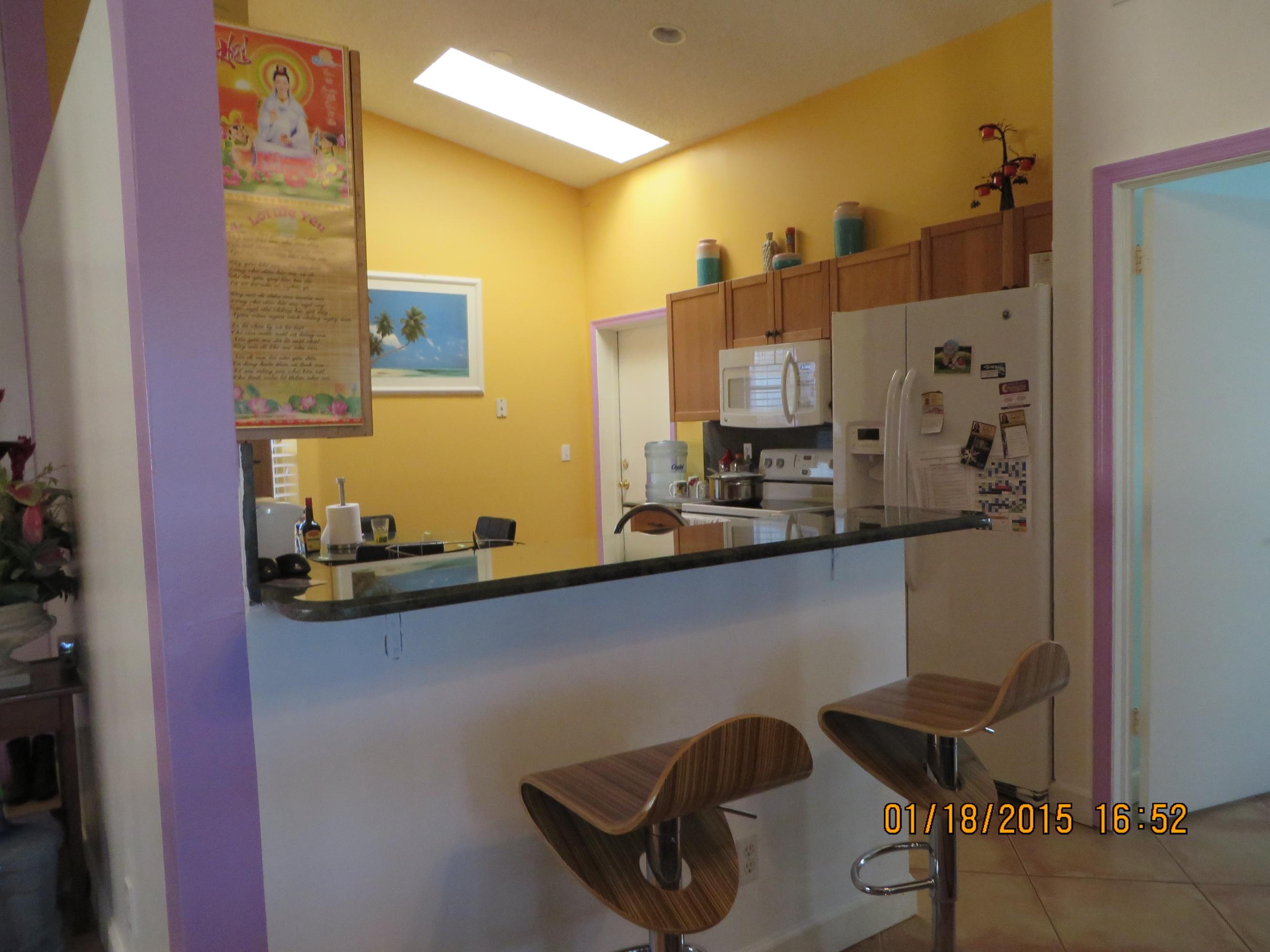 5227 Rosen Boulevard Boynton Beach, FL 33472 - Photo 15 of 53 open kitchen to dining room