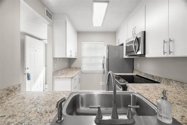 $1,995 | 1438 Millstream Lane, Unit 102, Dunedin, FL 34698