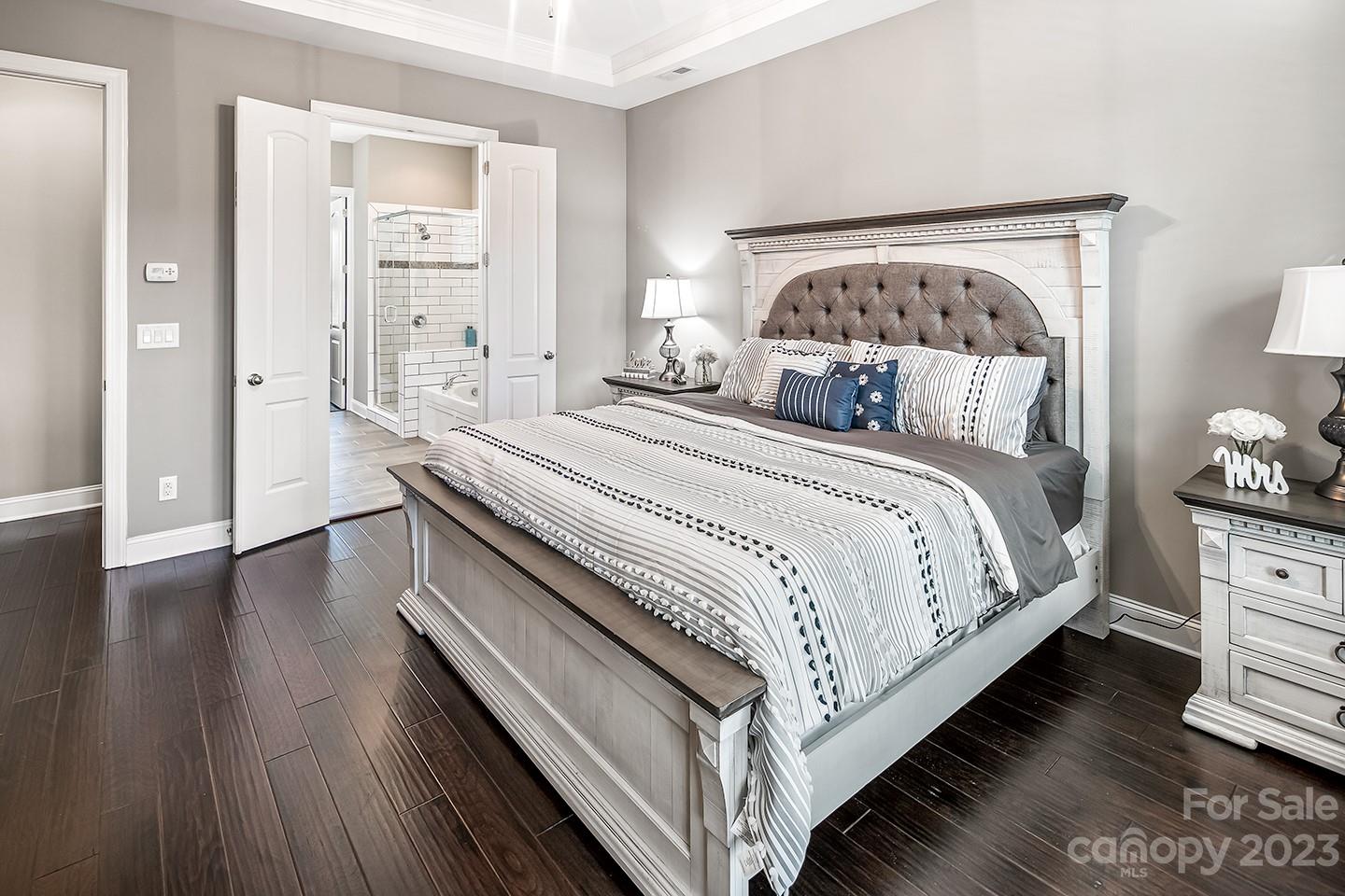 6004 Tremont Drive Indian Trail, NC 28079 - Photo 21 of 40 a bedroom with a bed and wooden floor