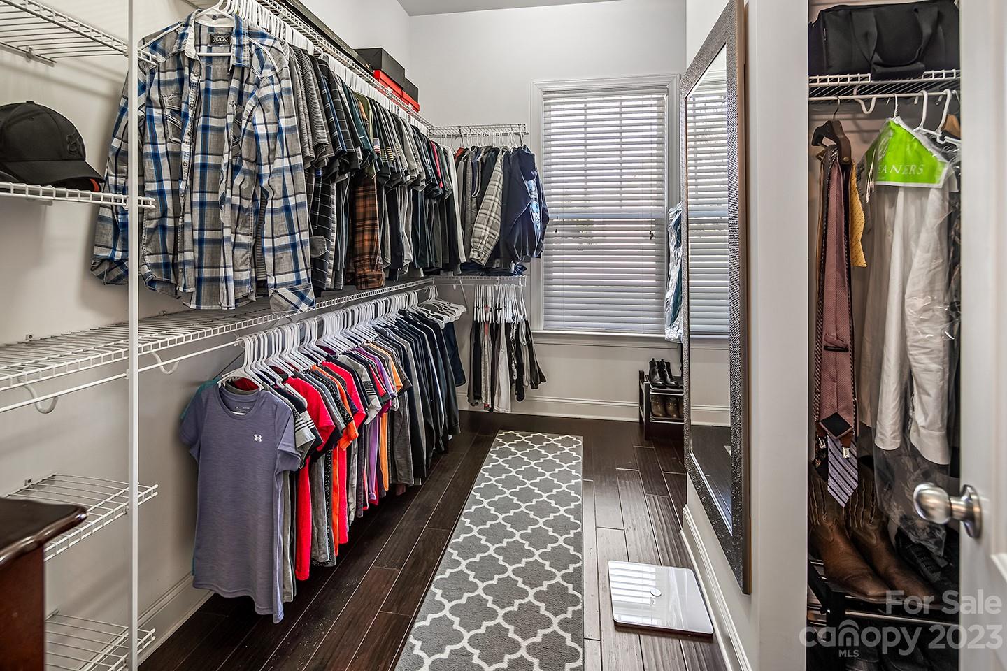 6004 Tremont Drive Indian Trail, NC 28079 - Photo 24 of 40 a view of walk in closet with clothes and shoes