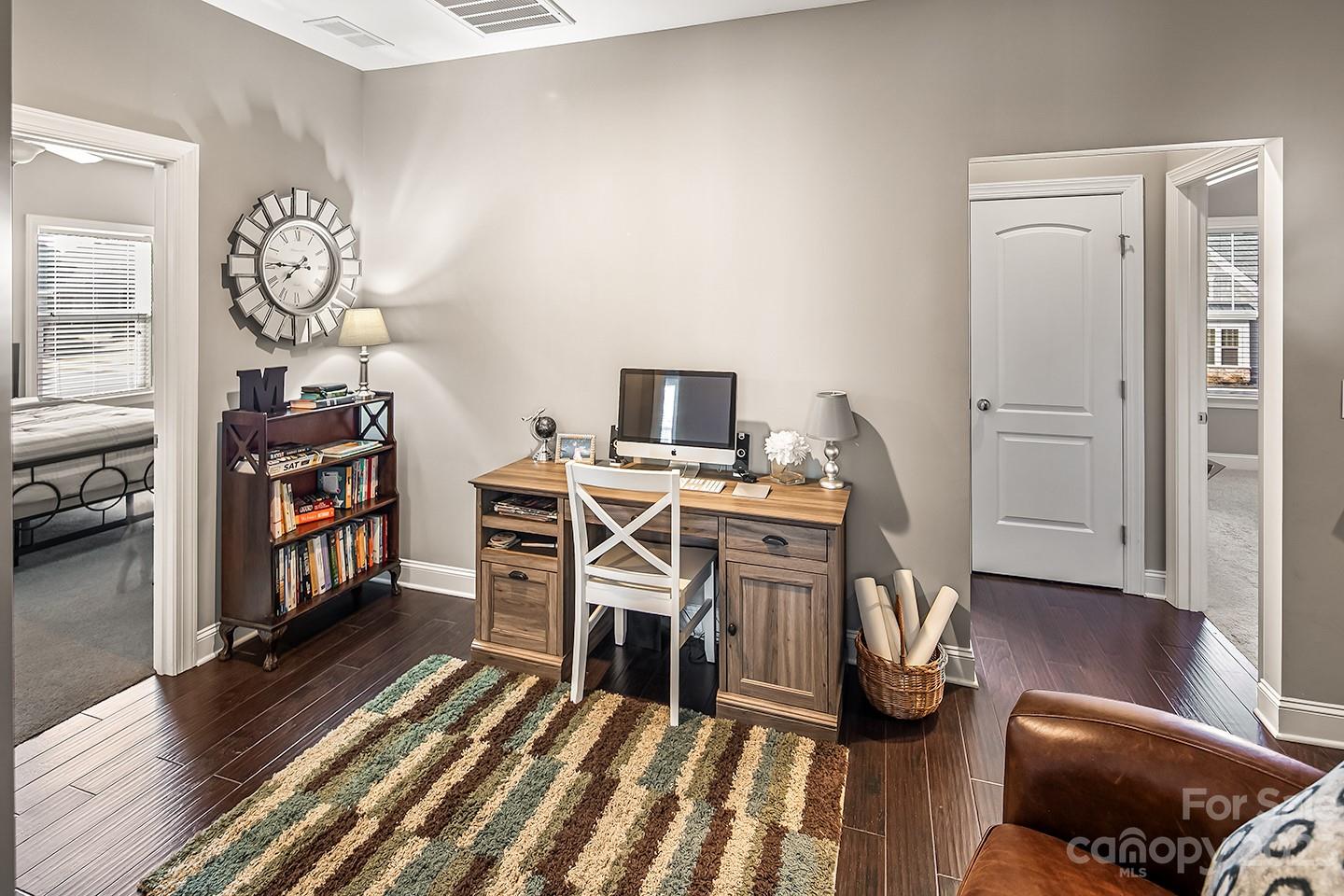 6004 Tremont Drive Indian Trail, NC 28079 - Photo 25 of 40 a view of a workspace with furniture and wooden floor