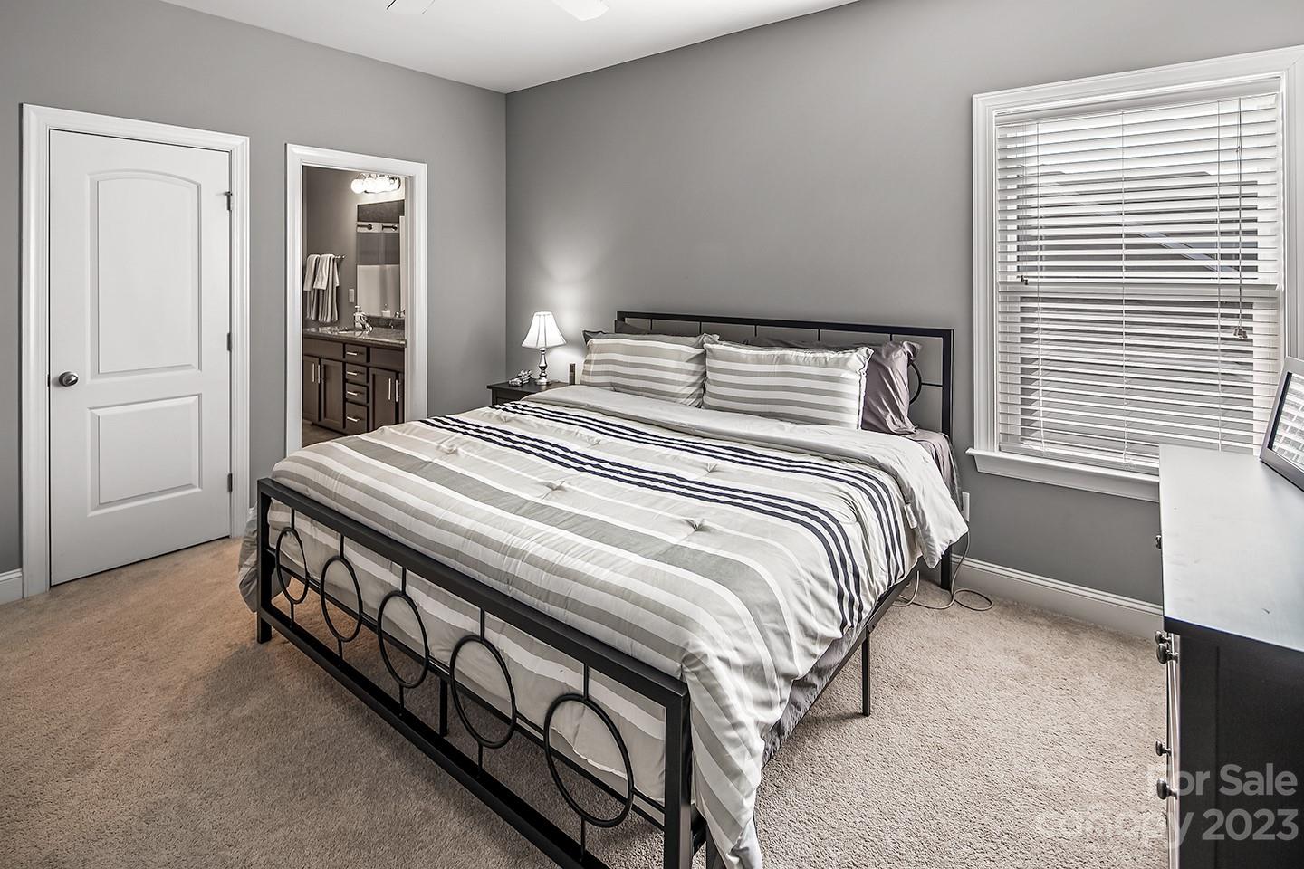 6004 Tremont Drive Indian Trail, NC 28079 - Photo 29 of 40 a bedroom with a bed and a window