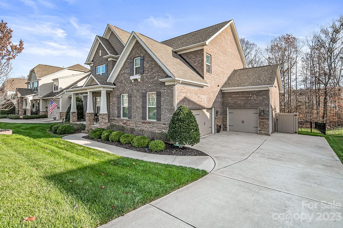 6004 Tremont Drive Indian Trail, NC 28079 - Photo 3 of 40 a front view of a house with a garden and plants