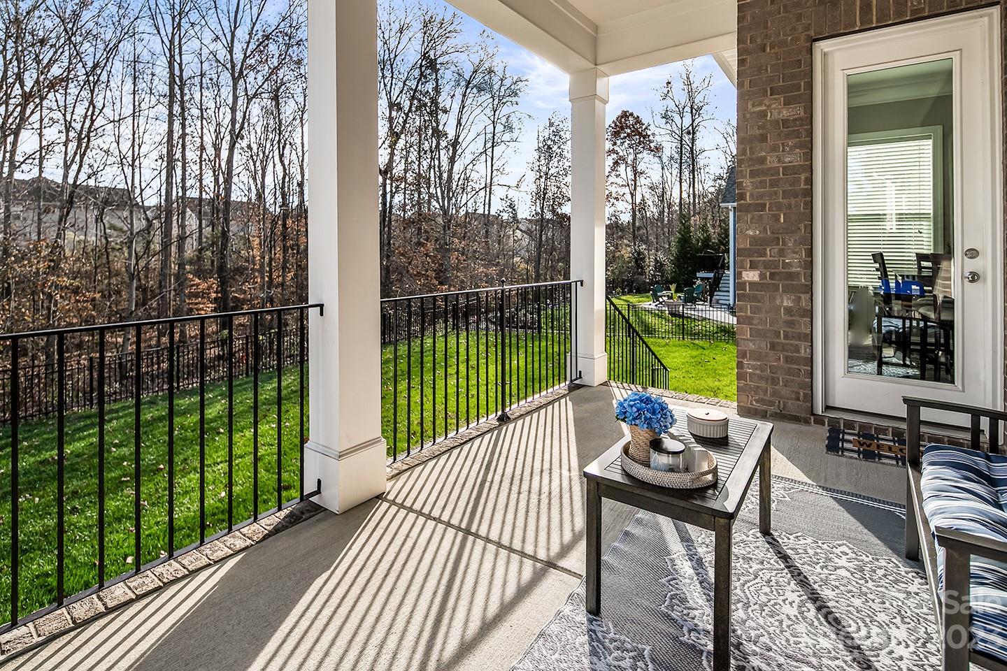 6004 Tremont Drive Indian Trail, NC 28079 - Photo 39 of 40 a balcony with wooden floor and outdoor seating