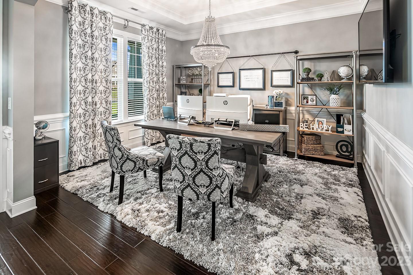 6004 Tremont Drive Indian Trail, NC 28079 - Photo 5 of 40 a kitchen with stainless steel appliances a dining table chairs and a refrigerator
