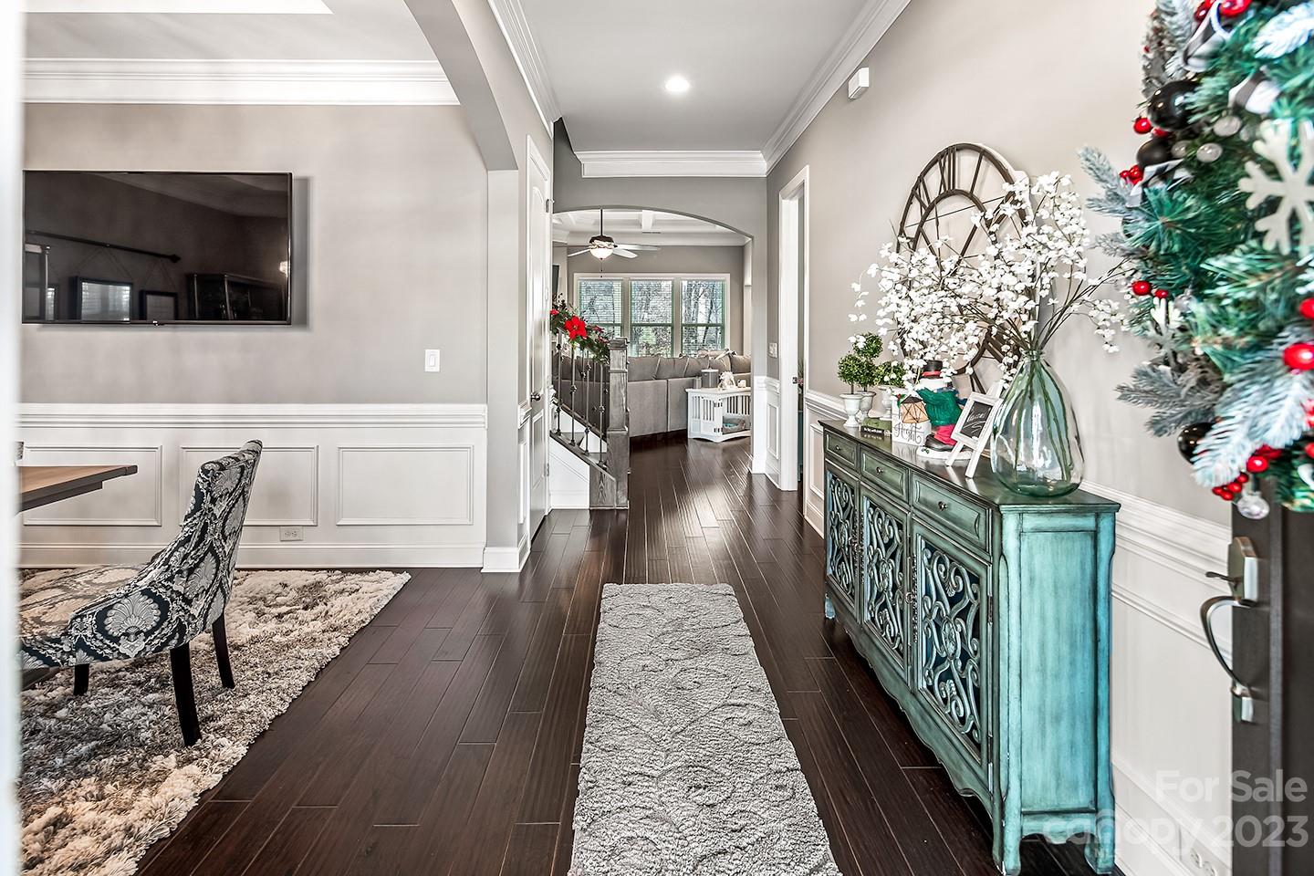 6004 Tremont Drive Indian Trail, NC 28079 - Photo 7 of 40 a hallway with a flower pot and a bookshelf