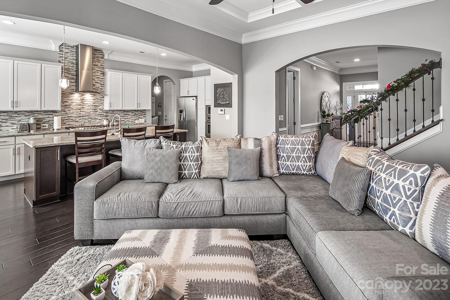 6004 Tremont Drive Indian Trail, NC 28079 - Photo 8 of 40 a large living room with stainless steel appliances furniture and a rug