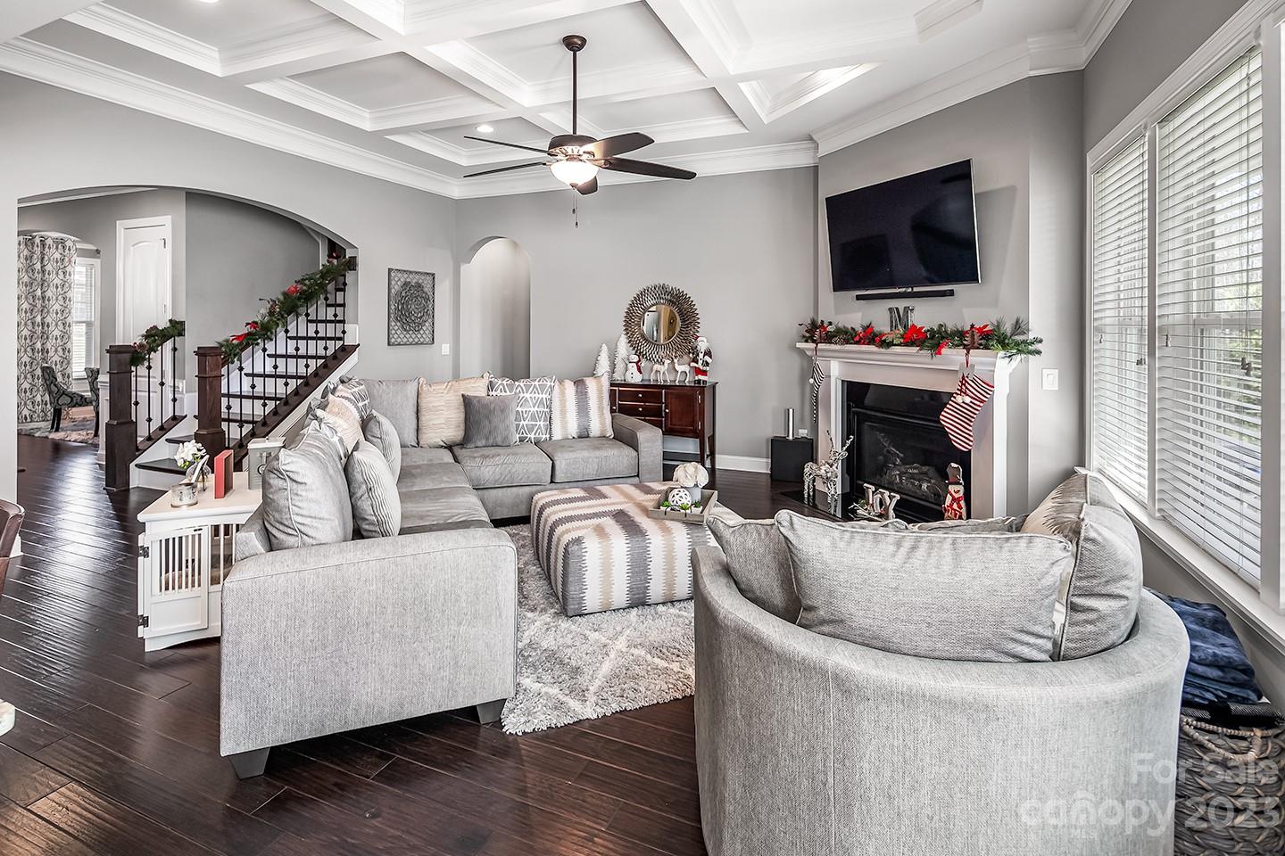 6004 Tremont Drive Indian Trail, NC 28079 - Photo 9 of 40 a living room with furniture a flat screen tv and a fireplace