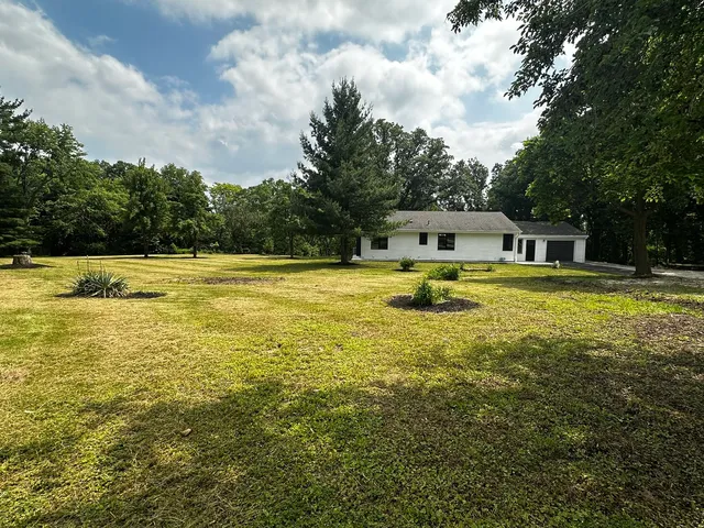 a view of a swimming pool with an outdoor seating