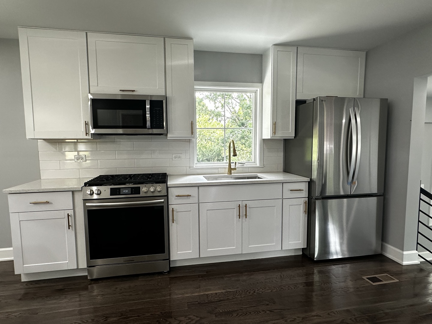 2212 North 2829th Road Marseilles, IL 61341 - Photo 12 of 44 a kitchen with a sink stove and refrigerator