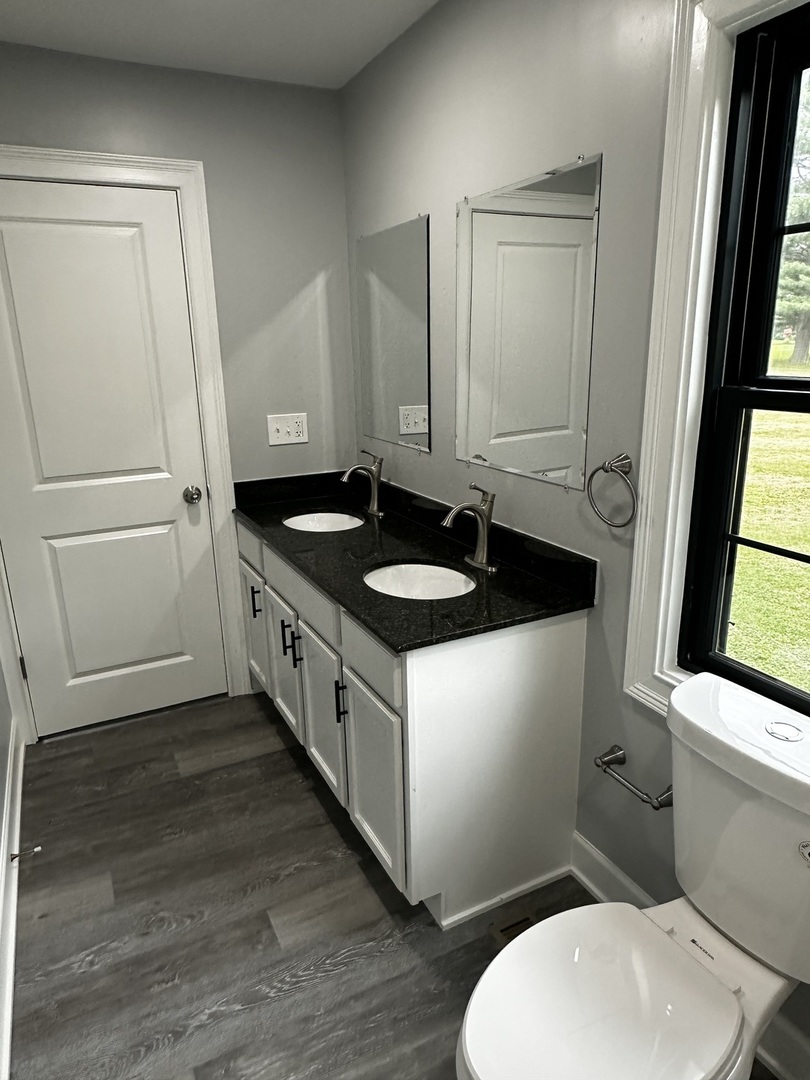 2212 North 2829th Road Marseilles, IL 61341 - Photo 22 of 44 a bathroom with a granite countertop sink and a mirror