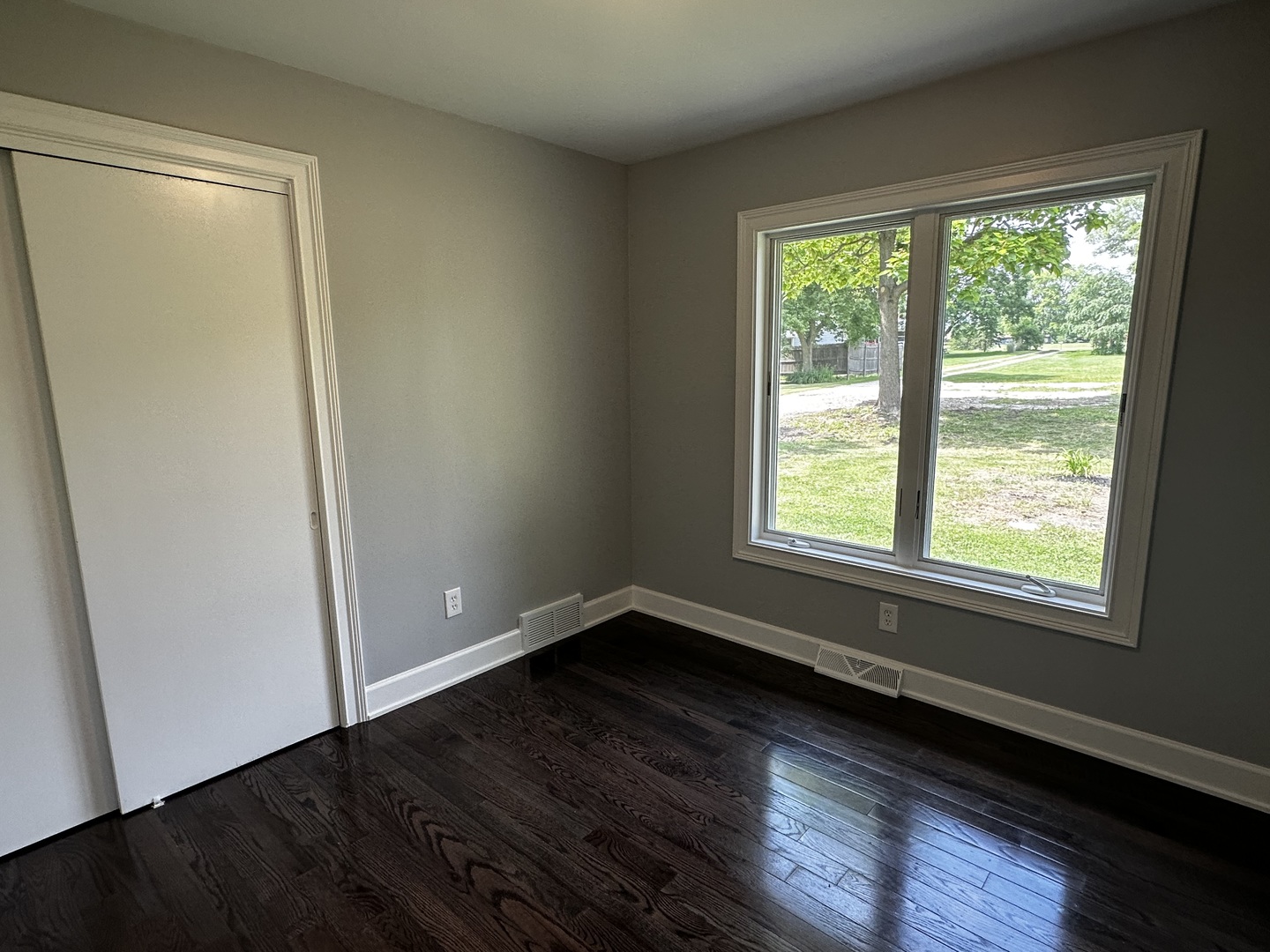 2212 North 2829th Road Marseilles, IL 61341 - Photo 23 of 44 an empty room with wooden floor and windows