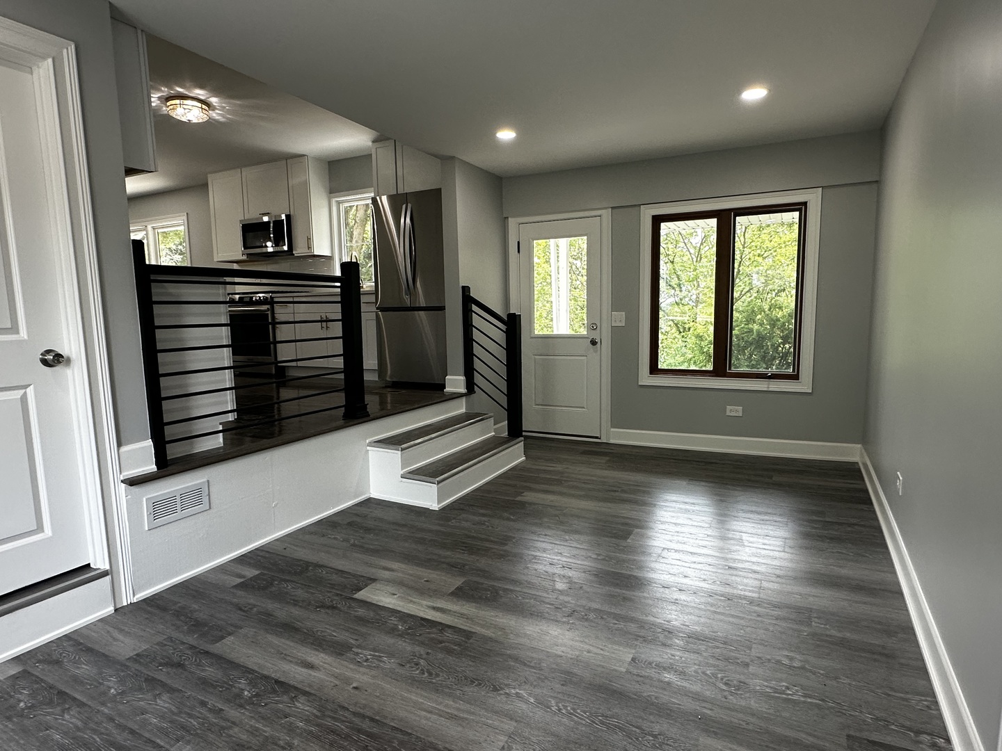 2212 North 2829th Road Marseilles, IL 61341 - Photo 6 of 44 a view of an empty room with wooden floor and a window