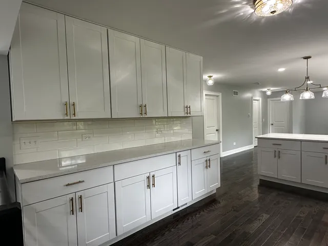 a kitchen with sink cabinets and window