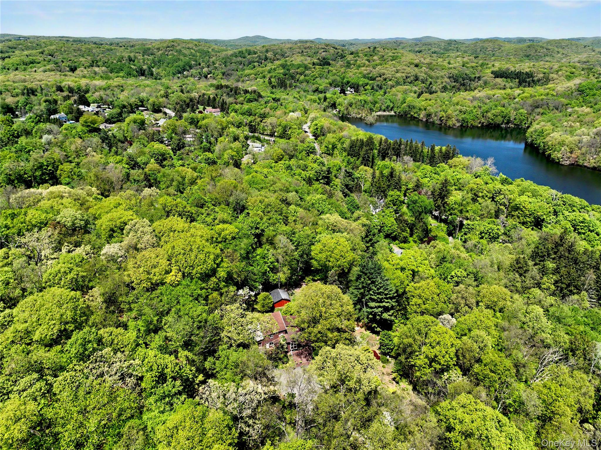 631 Croton Falls Road Carmel, NY 10512 - Photo 3 of 43 a view of a garden with a lake