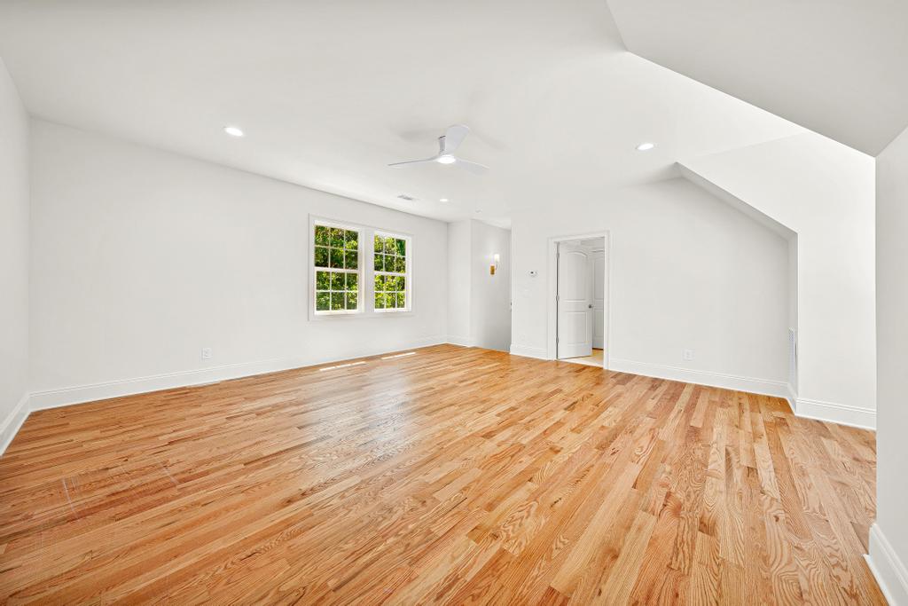 707 Vickery Street Extension Hartwell, GA 30643 - Photo 34 of 50 Natural light illuminates lustrous hardwood floors in this spacious, adaptable room.