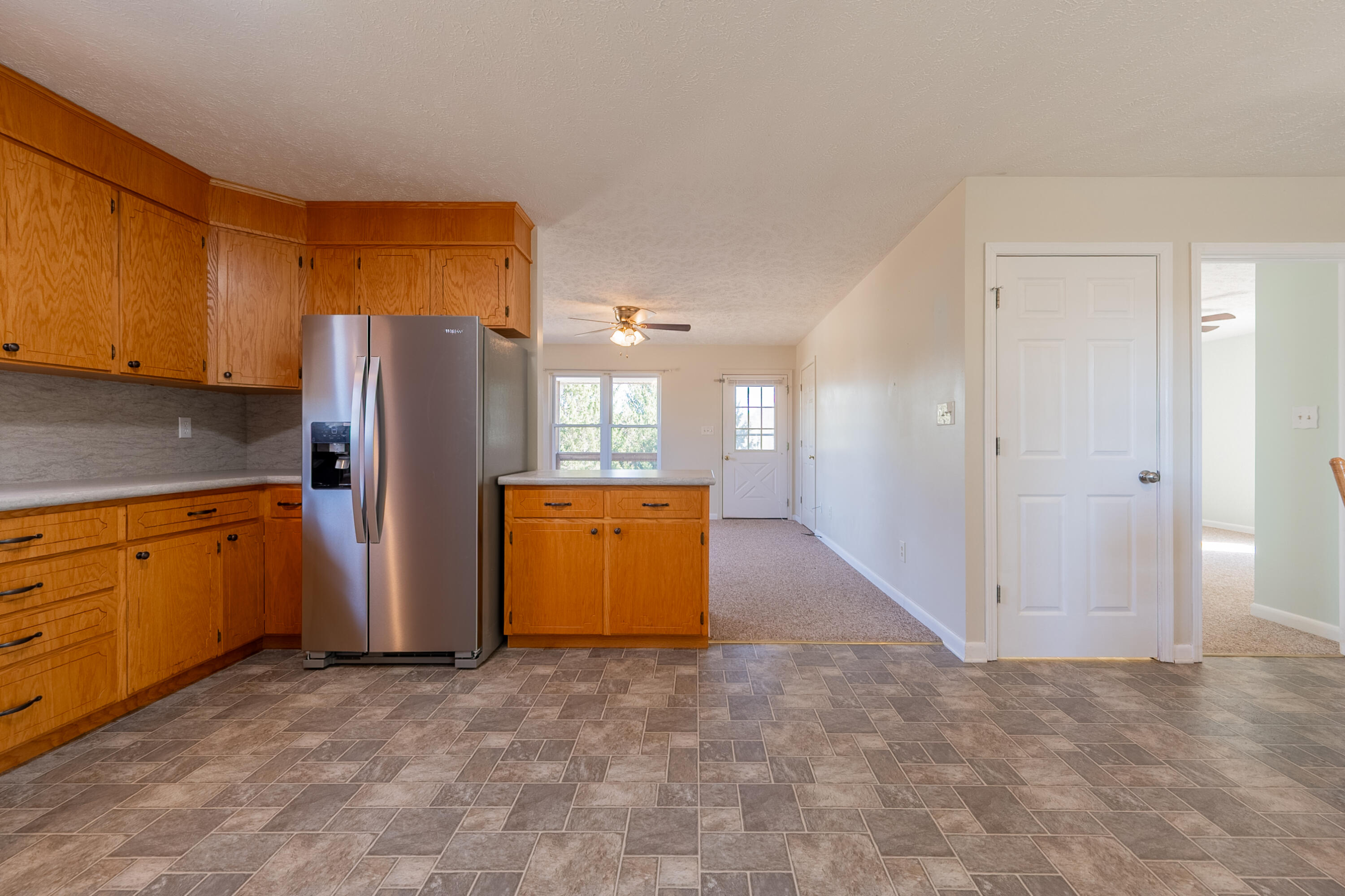 2448 Kyle Weeks Road Southwest Willis, VA 24380 - Photo 19 of 65 a view of a kitchen with refrigerator and microwave