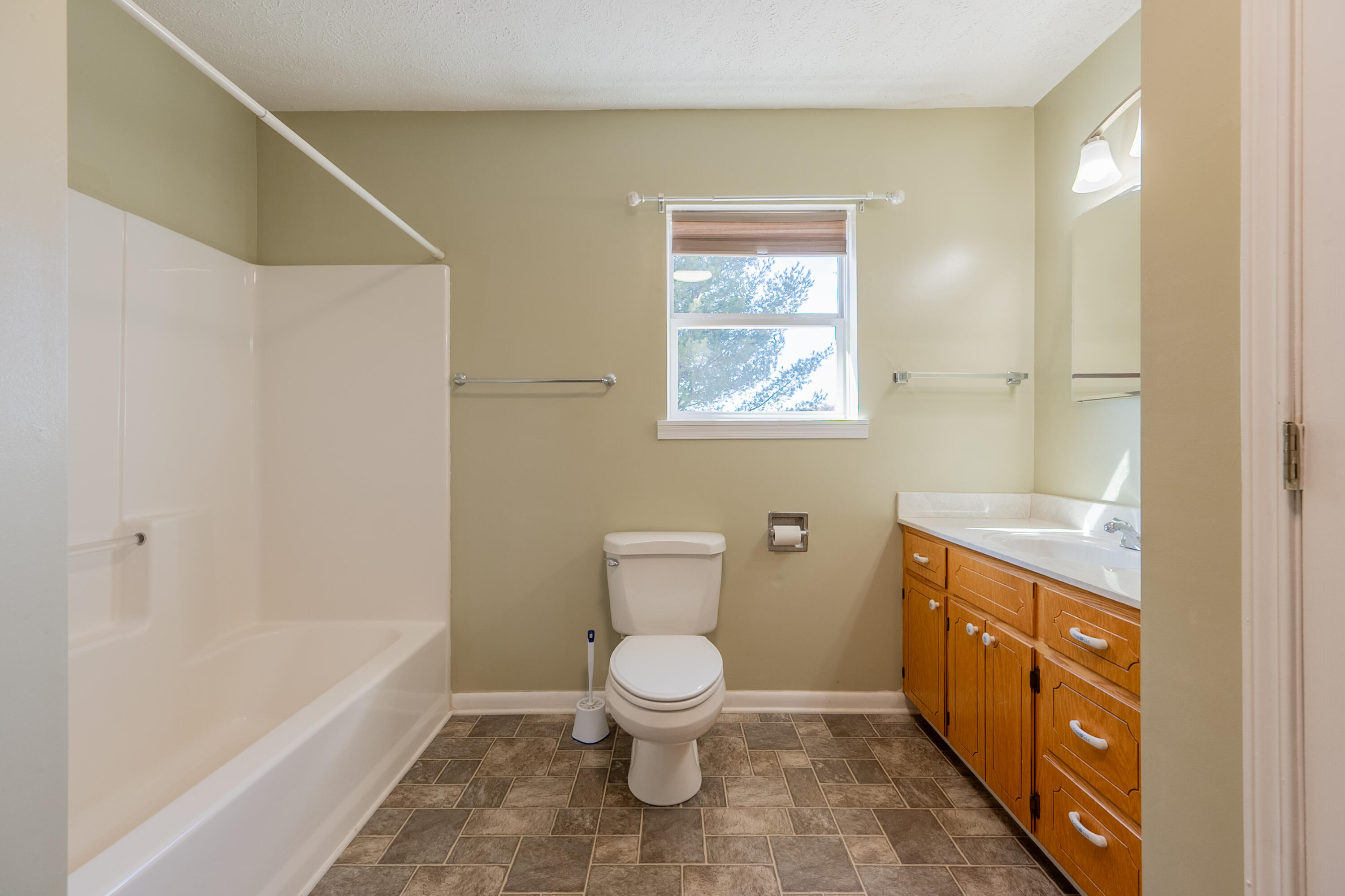 2448 Kyle Weeks Road Southwest Willis, VA 24380 - Photo 24 of 65 a bathroom with a toilet sink and a bathtub