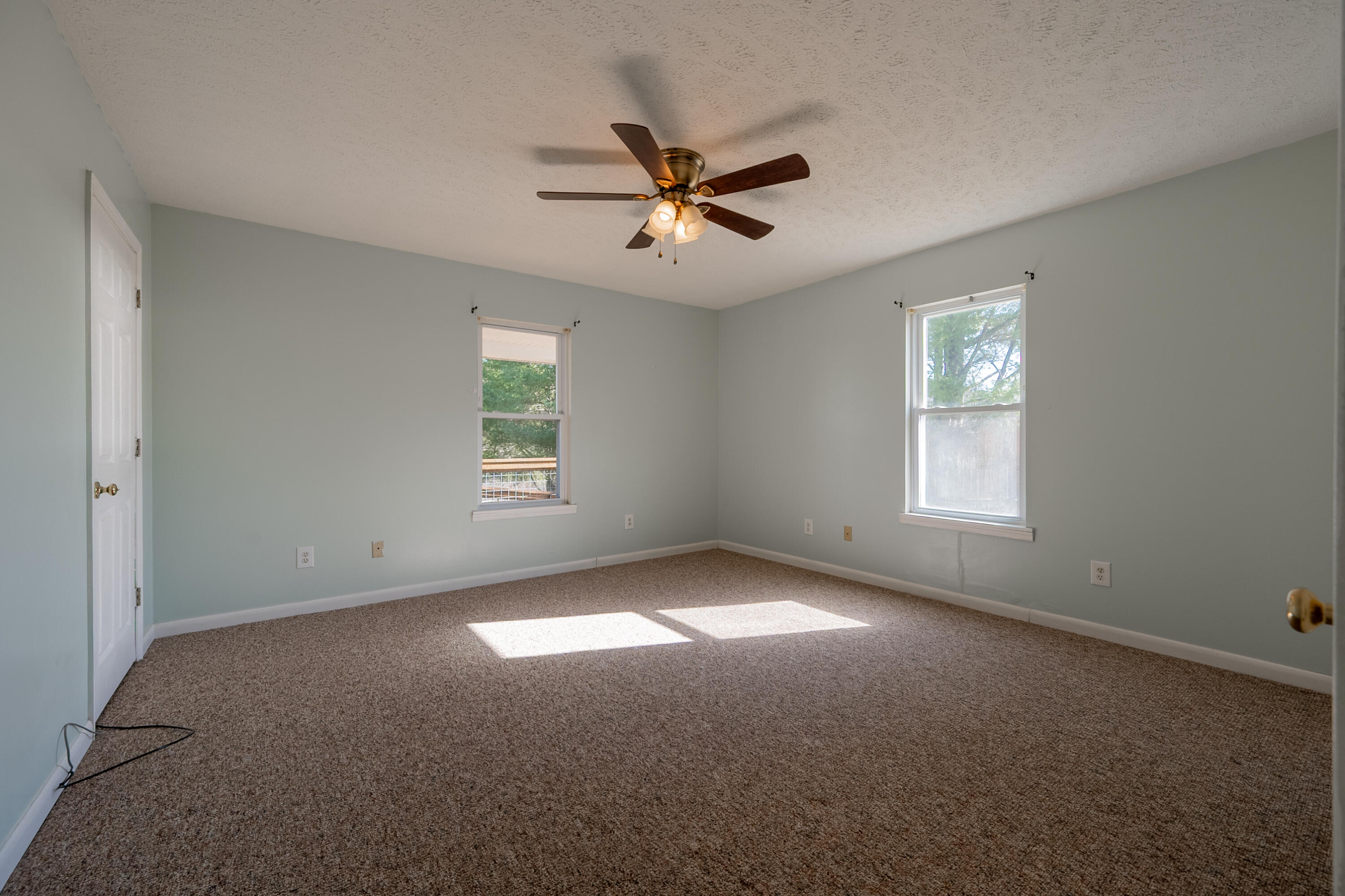 2448 Kyle Weeks Road Southwest Willis, VA 24380 - Photo 26 of 65 a view of a livingroom with a ceiling fan and window