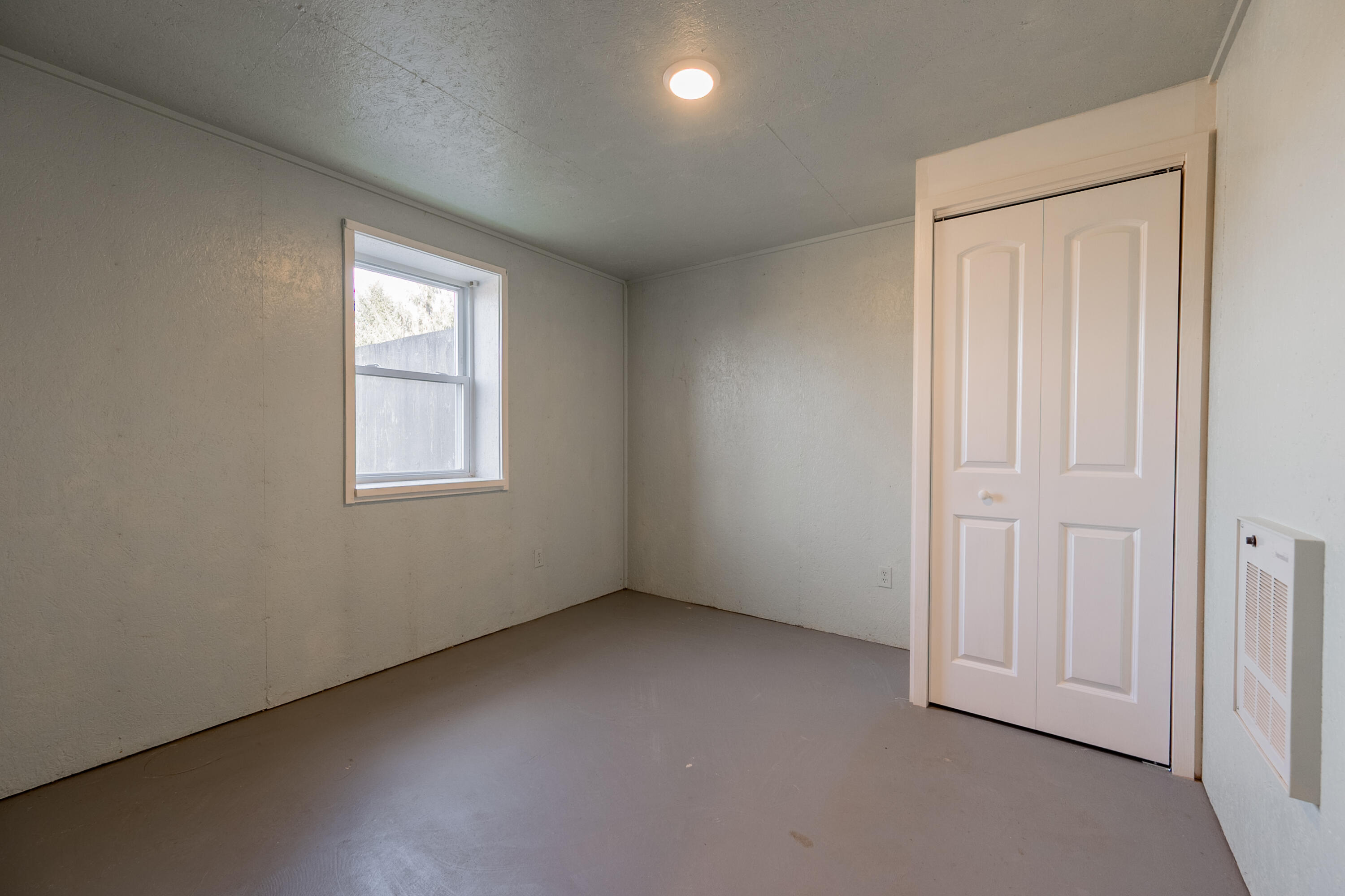 2448 Kyle Weeks Road Southwest Willis, VA 24380 - Photo 42 of 65 an empty room with windows