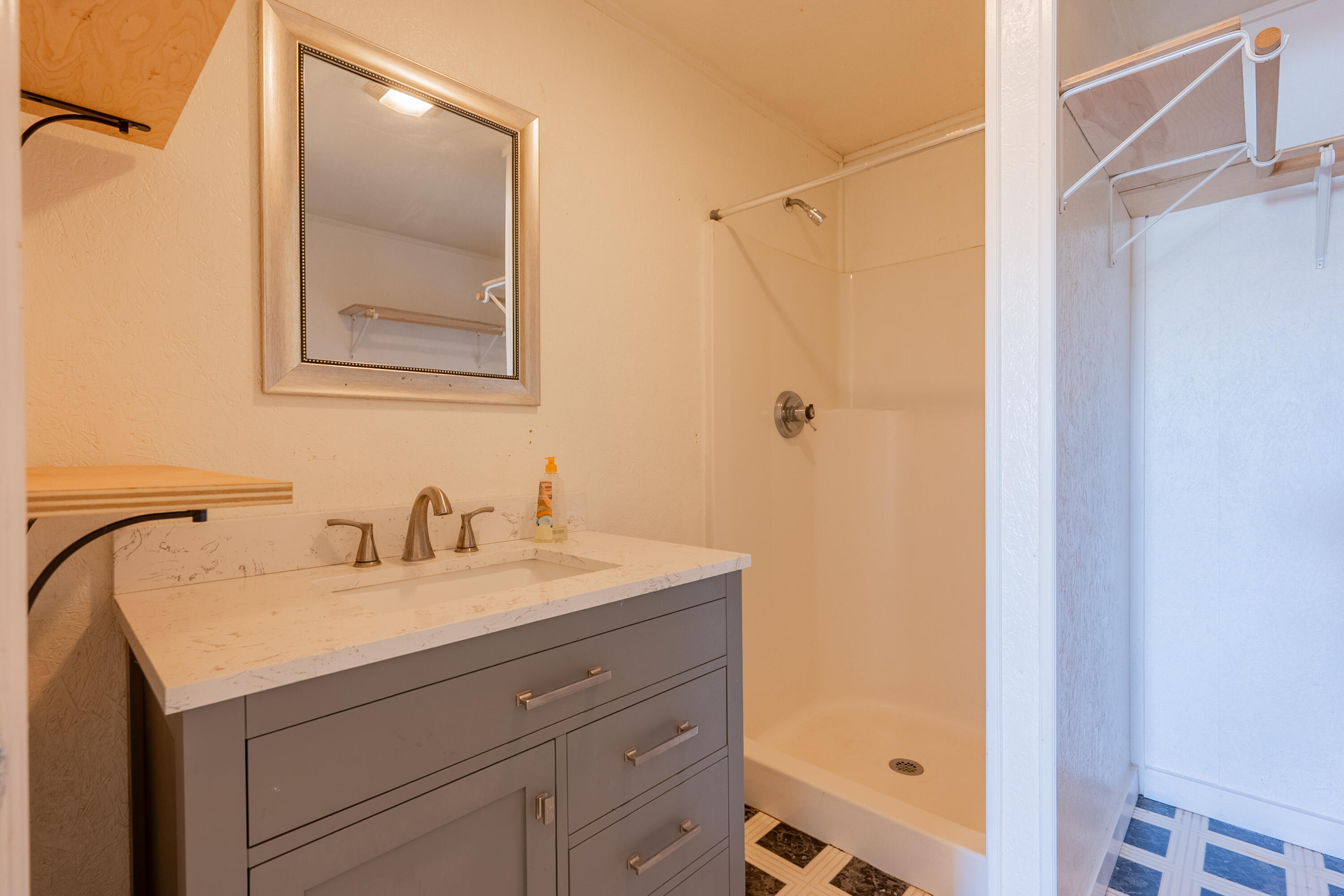 2448 Kyle Weeks Road Southwest Willis, VA 24380 - Photo 44 of 65 a bathroom with a sink and a mirror