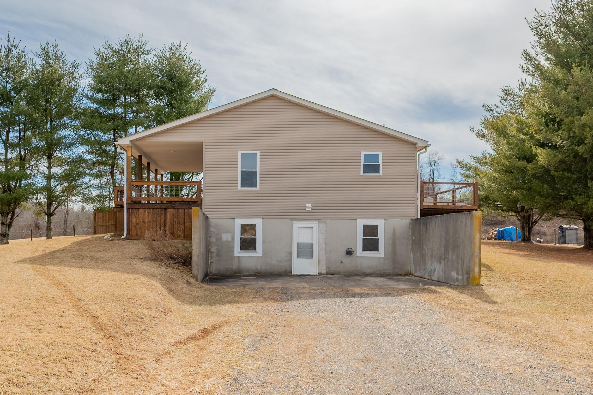 2448 Kyle Weeks Road Southwest Willis, VA 24380 - Photo 55 of 65 a house that has a tree in front of it