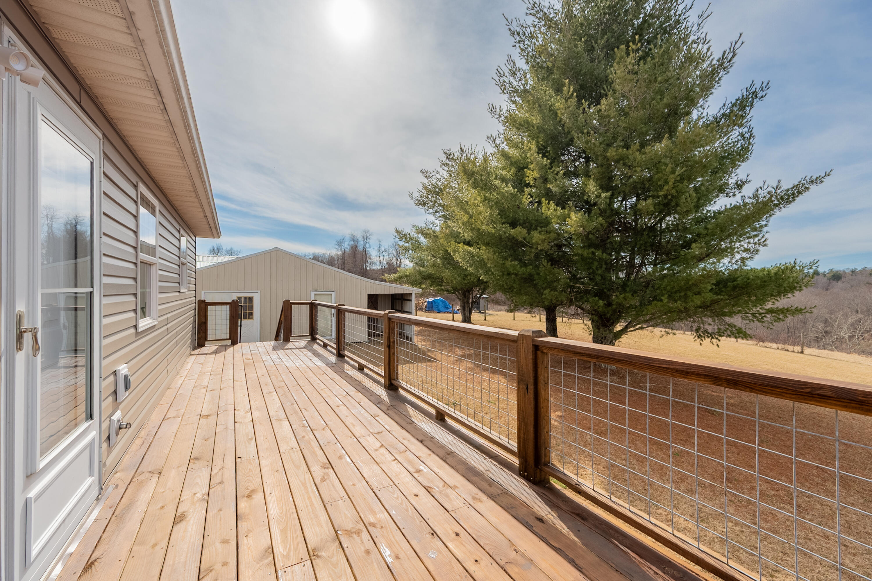 2448 Kyle Weeks Road Southwest Willis, VA 24380 - Photo 59 of 65 a view of balcony with wooden floor and fence