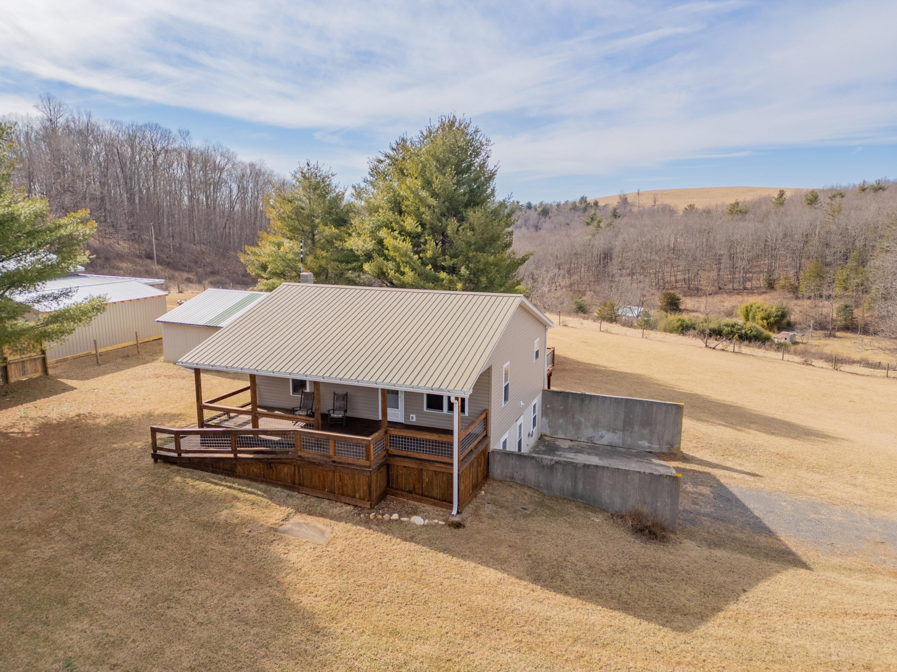 2448 Kyle Weeks Road Southwest Willis, VA 24380 - Photo 62 of 65 a view of a patio with a table and chairs