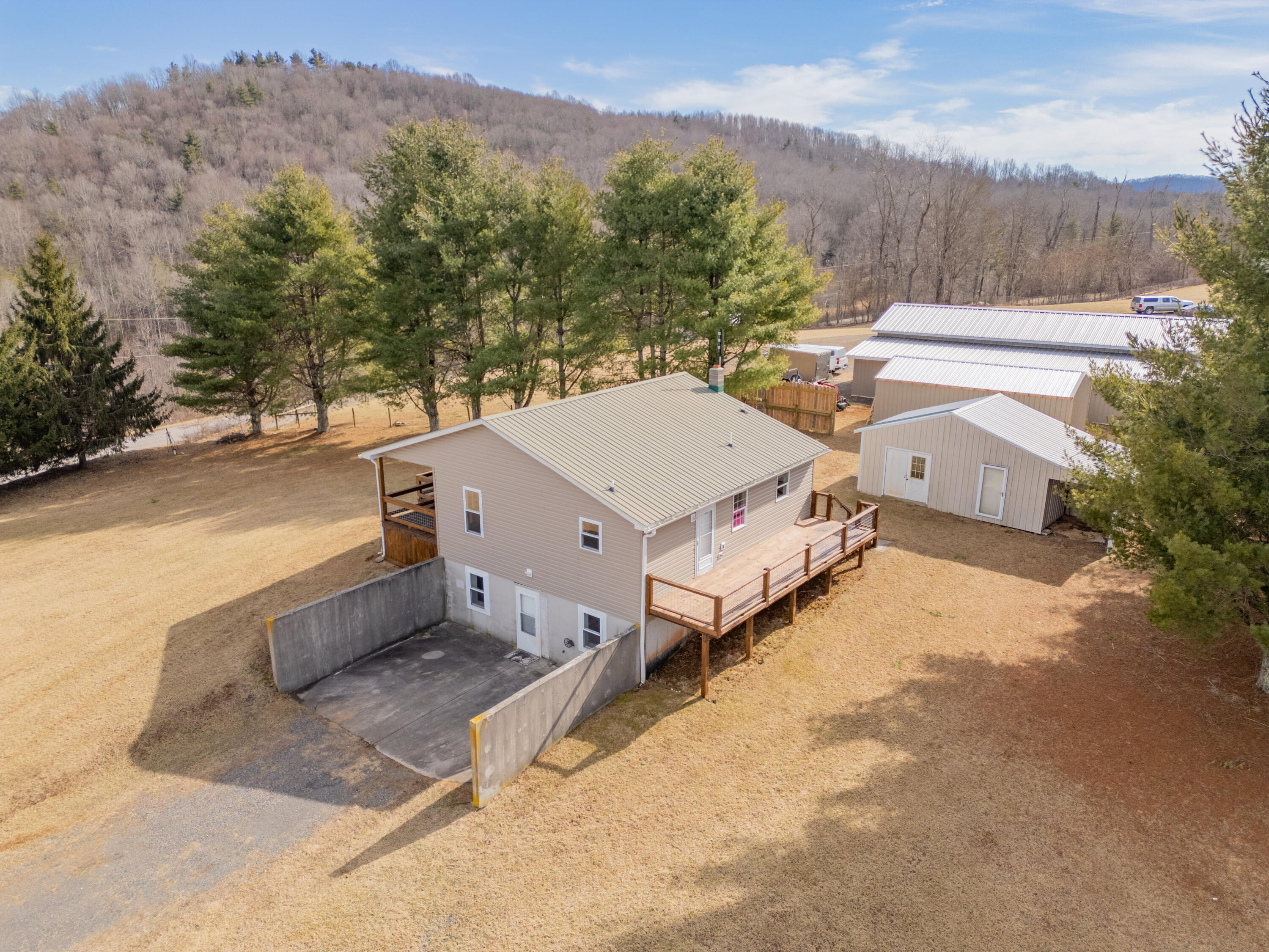 2448 Kyle Weeks Road Southwest Willis, VA 24380 - Photo 64 of 65 an aerial view of a house with a yard and mountain view
