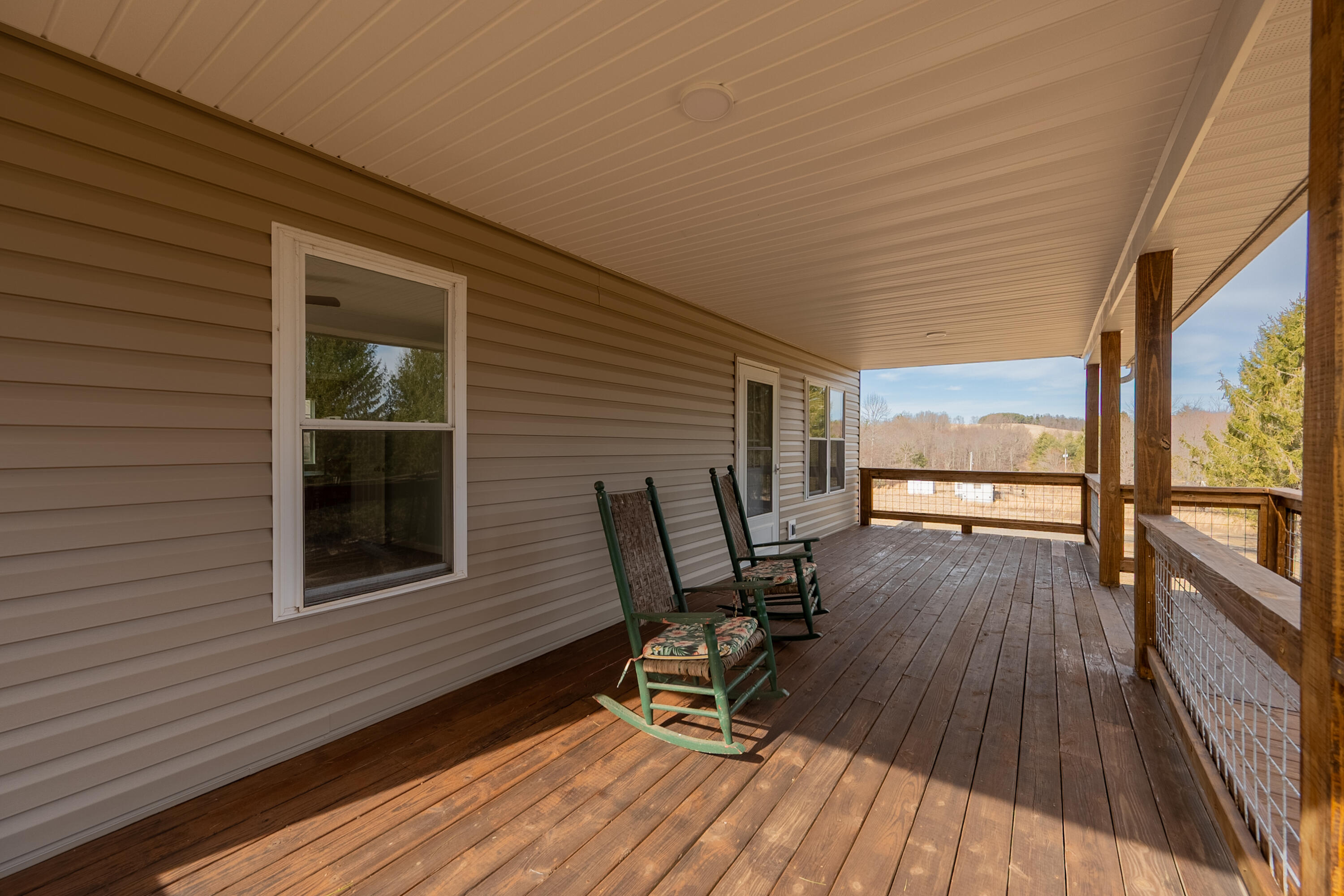 2448 Kyle Weeks Road Southwest Willis, VA 24380 - Photo 9 of 65 a view of a two chairs in the balcony