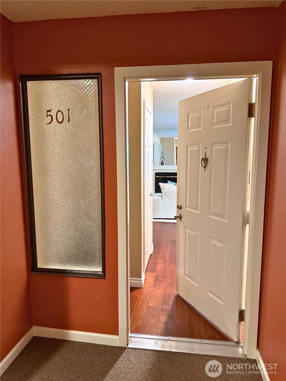 7600 Southeast 29th Street, Unit 501 Mercer Island, WA 98040 - Photo 2 of 21 a view of hallway with wooden floor