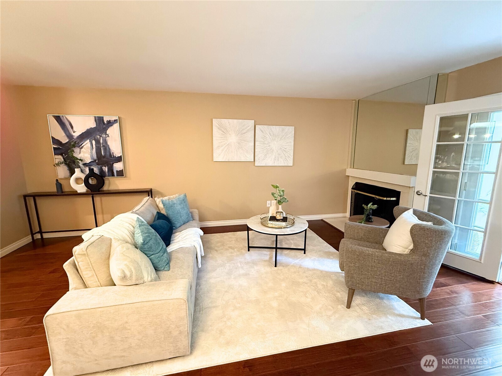 7600 Southeast 29th Street, Unit 501 Mercer Island, WA 98040 - Photo 3 of 21 a living room with furniture and a fireplace