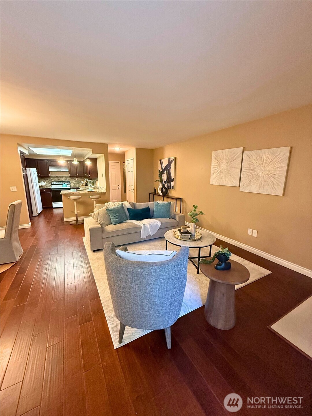7600 Southeast 29th Street, Unit 501 Mercer Island, WA 98040 - Photo 5 of 21 a living room with couches and coffee table with wooden floor