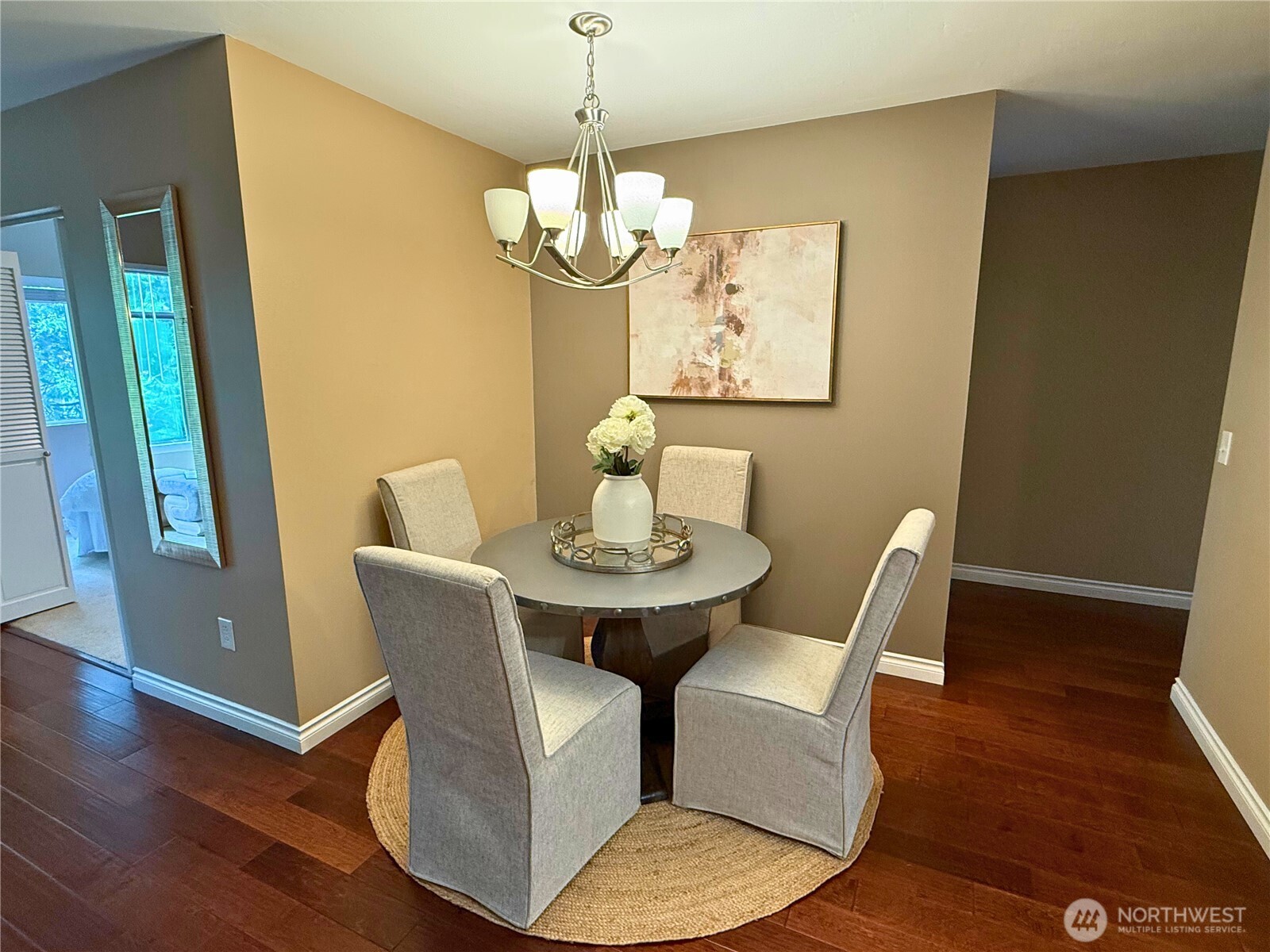 7600 Southeast 29th Street, Unit 501 Mercer Island, WA 98040 - Photo 7 of 21 a view of a dining room with furniture wooden floor and a chandelier