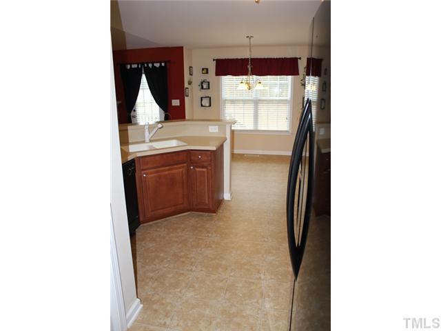 407 Ridge Road Angier, NC 27501 - Photo 9 of 25 Here is a view from the kitchen into the eat-in breakfast area.