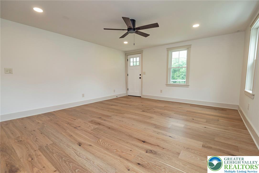 72 Allegheny Road Mount Bethel, PA 18343 - Photo 20 of 72 Natural light floods this inviting room with rich hardwood floors and recessed lighting.