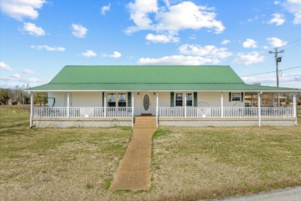 3261 Bell Road Watertown, TN 37184 - Photo 1 of 3 a front view of a house with swimming pool having outdoor seating