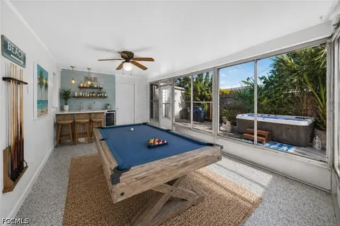 a view of a patio with a dining table and chairs