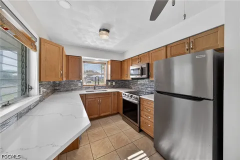 a kitchen with a sink and a window