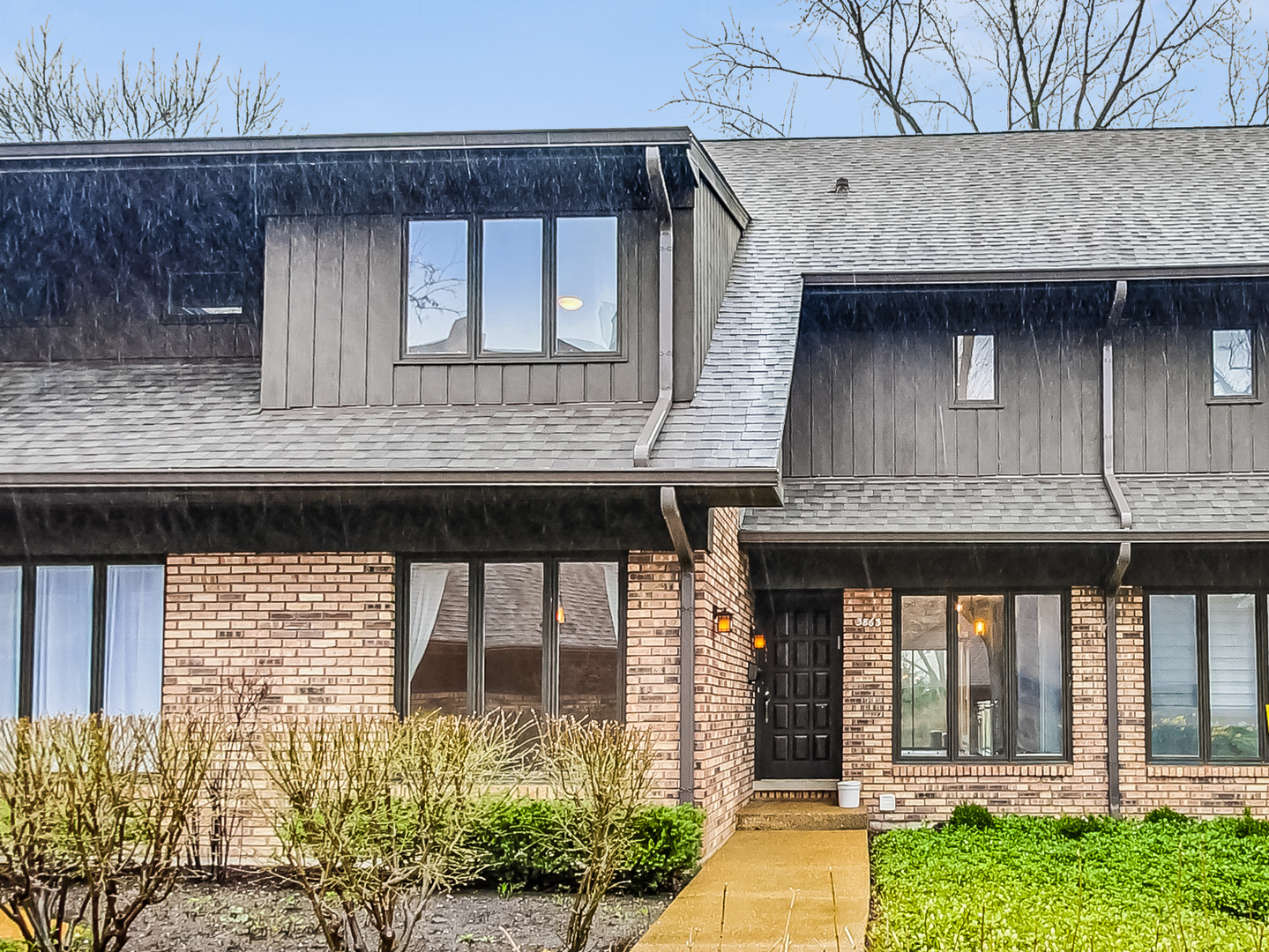 3863 Mission Hills Road Northbrook, IL 60062 - Photo 1 of 1 a front view of a house with a garden