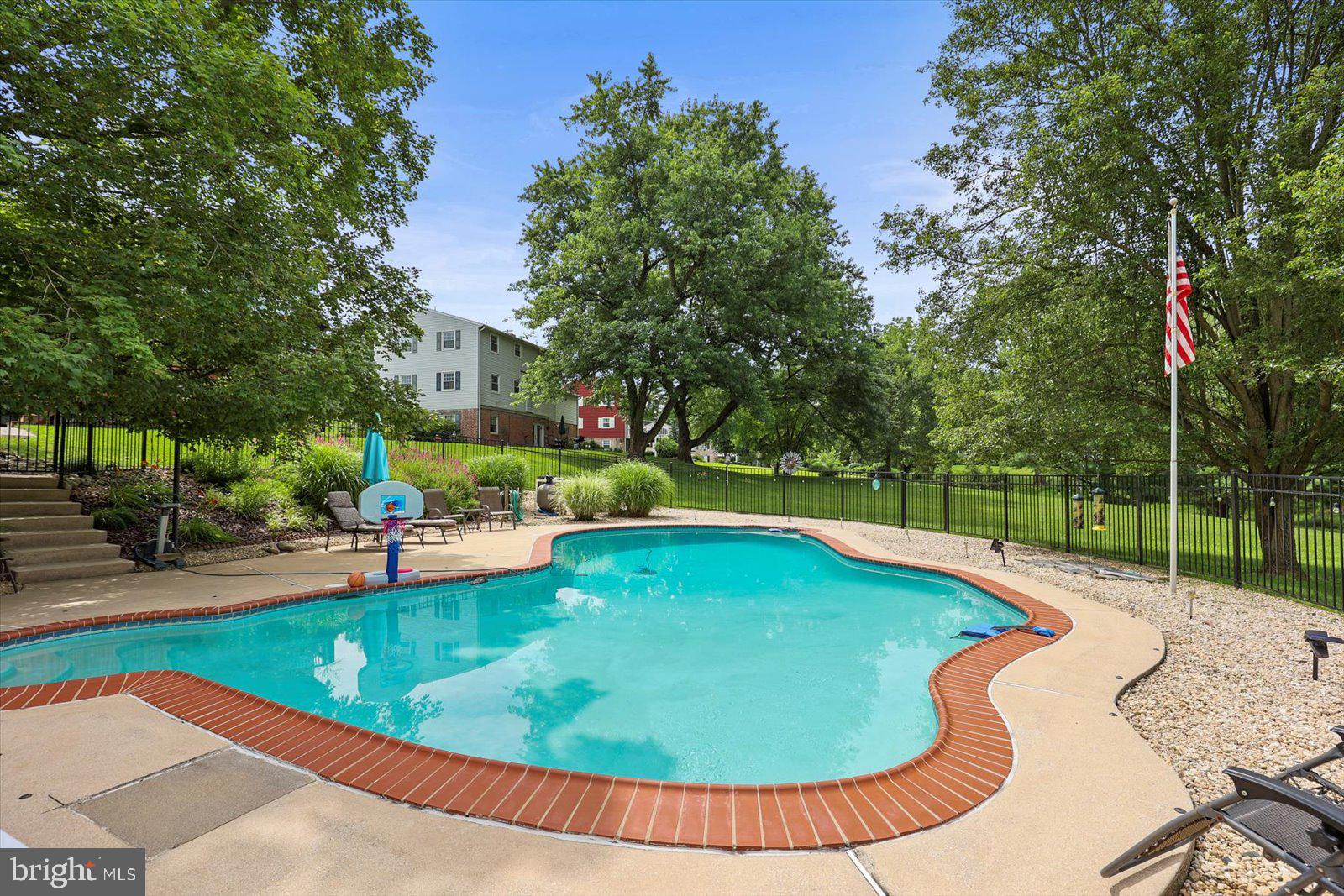 124 Lexington Road York, PA 17402 - Photo 2 of 56 a view of a swimming pool with a patio