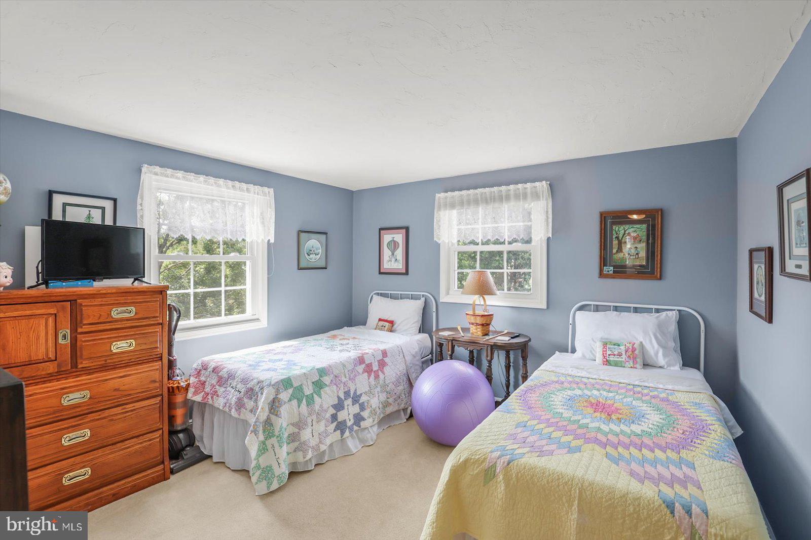 124 Lexington Road York, PA 17402 - Photo 21 of 56 a bedroom with a bed and flat screen tv