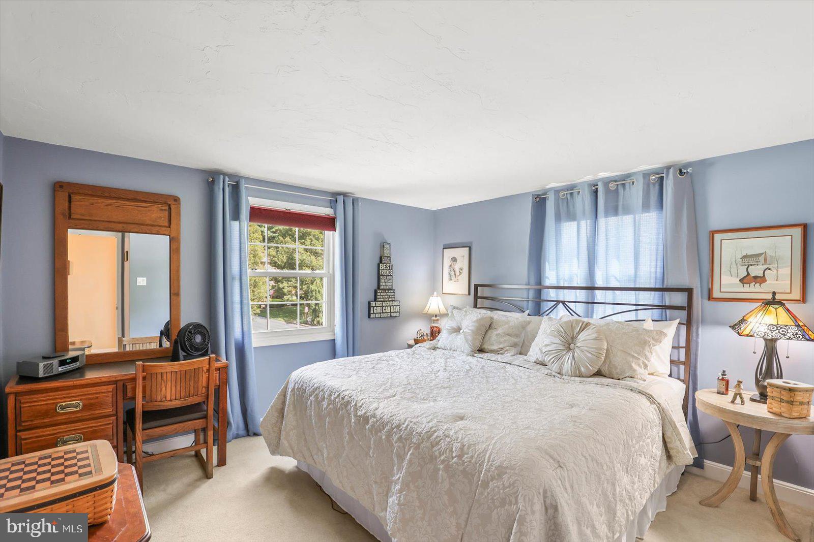 124 Lexington Road York, PA 17402 - Photo 26 of 56 a bedroom with a bed and a couch next to a window
