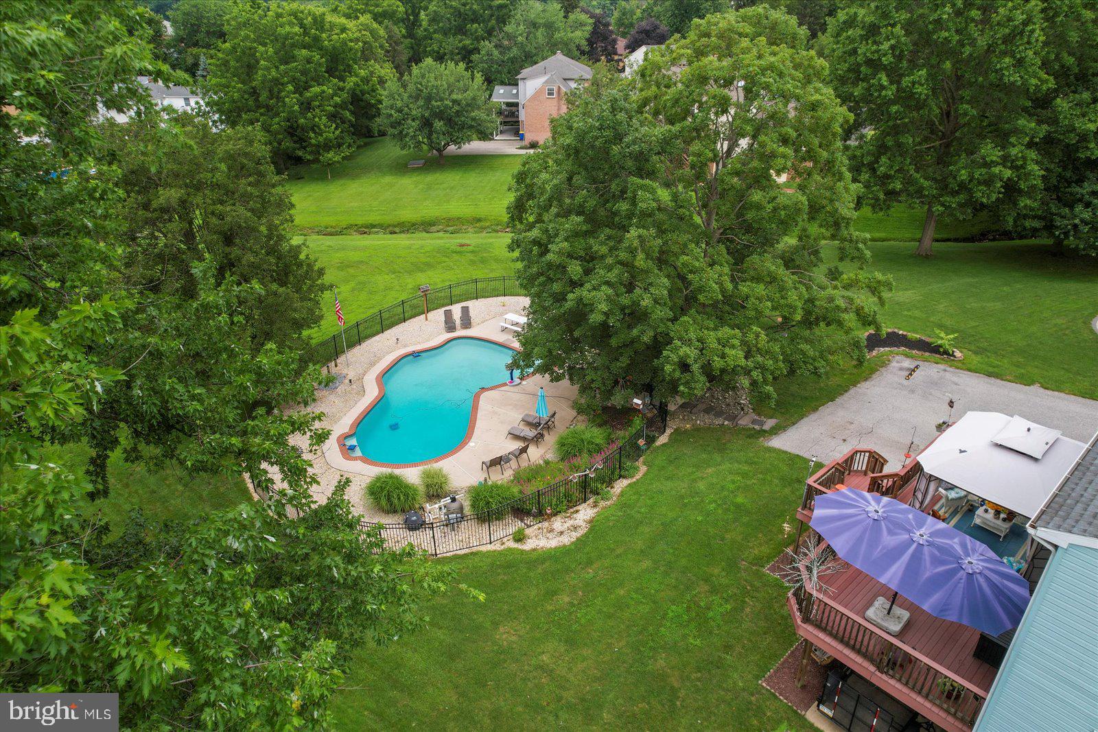 124 Lexington Road York, PA 17402 - Photo 3 of 56 an aerial view of a house with outdoor space pool seating area and yard