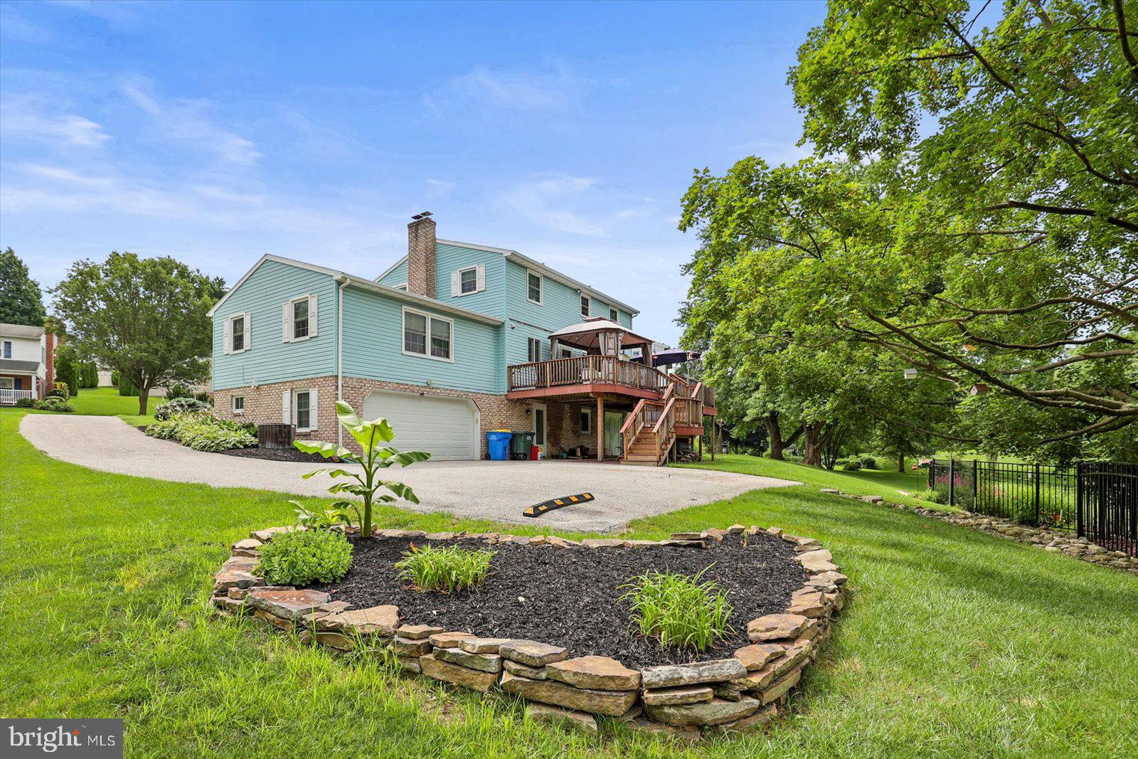 124 Lexington Road York, PA 17402 - Photo 4 of 56 a front view of a house with a yard and potted plants