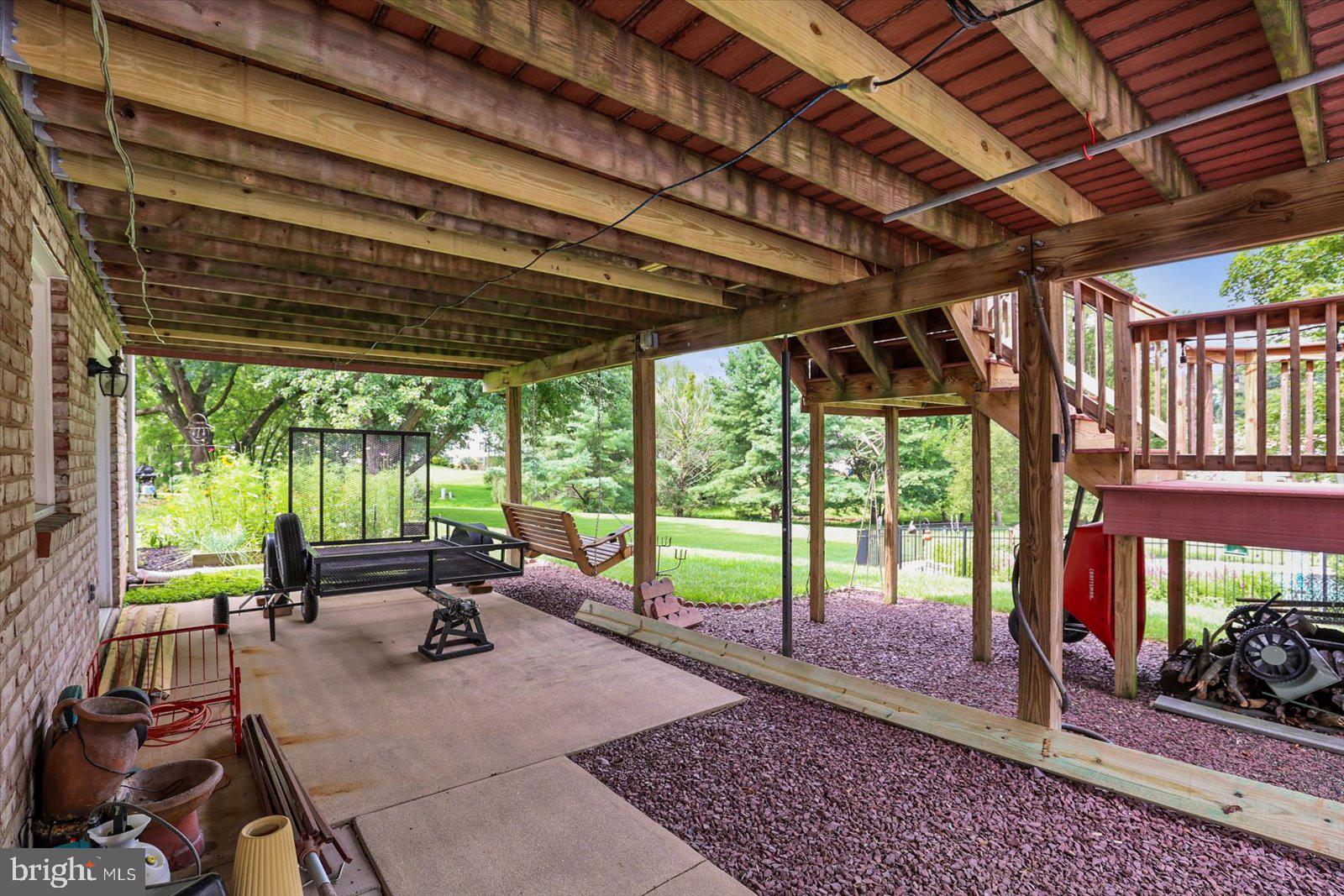 124 Lexington Road York, PA 17402 - Photo 41 of 56 a view of a patio with table and chairs next to a yard